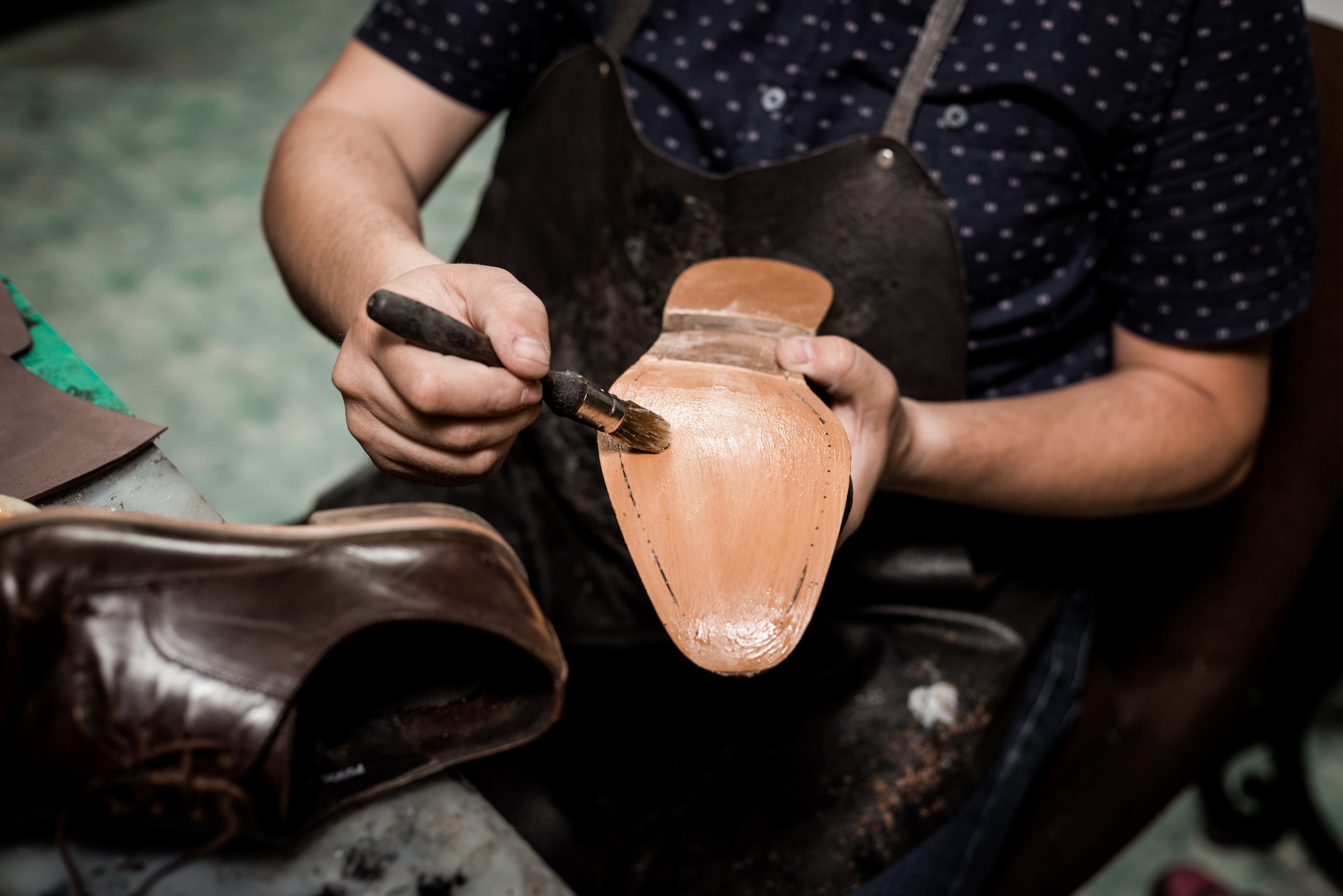 Cobbler repairing shoes